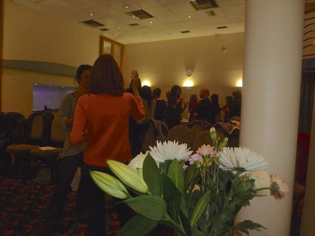 Flowers and people in a room