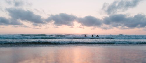 Calm sea, breakers, sunset