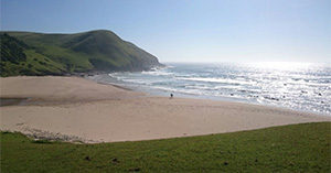 scene of mountains and beach